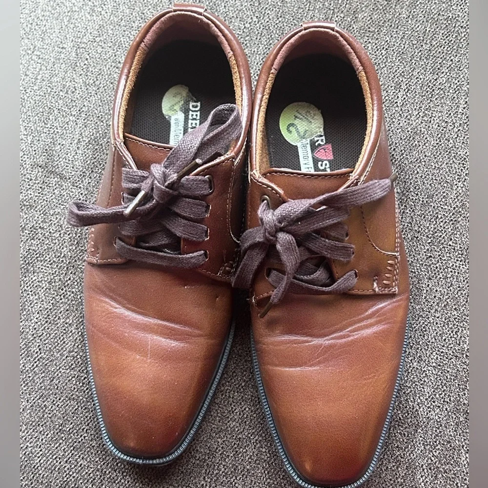 Deer stags brown boy dressing shoes